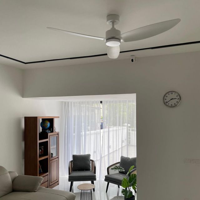 black ceiling fan in white room